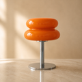 Lexion Aurora macaron table lamp on a clean warm premium background