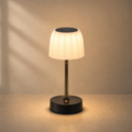 Lexion Focus rechargeable reading lamp on a clean warm premium background