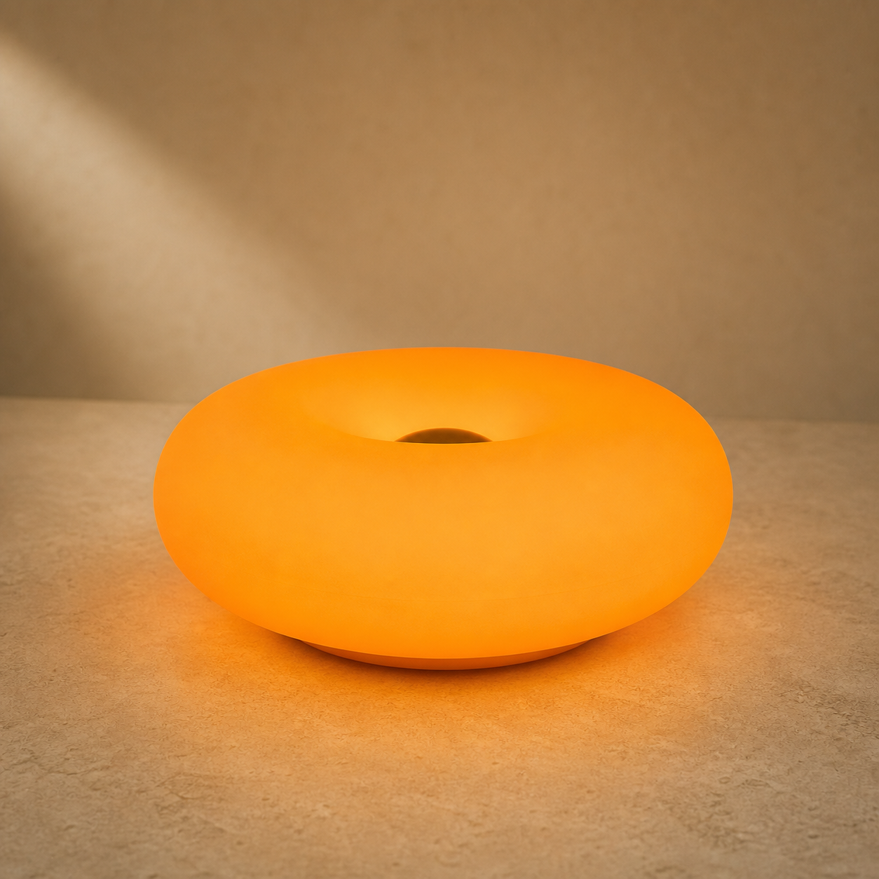 Lexion Orbit glowing ring table lamp on a premium warm studio background