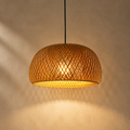 Lexion Rattan Cove single pendant light on a clean warm premium background