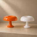 Lexion Solara orange and white mushroom table lamps on a premium studio background