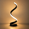 Lexion Spiral LED table lamp on a clean warm premium background